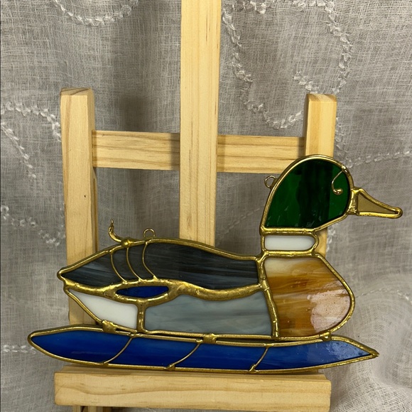 Handmade stained glass gorgeous duck on water